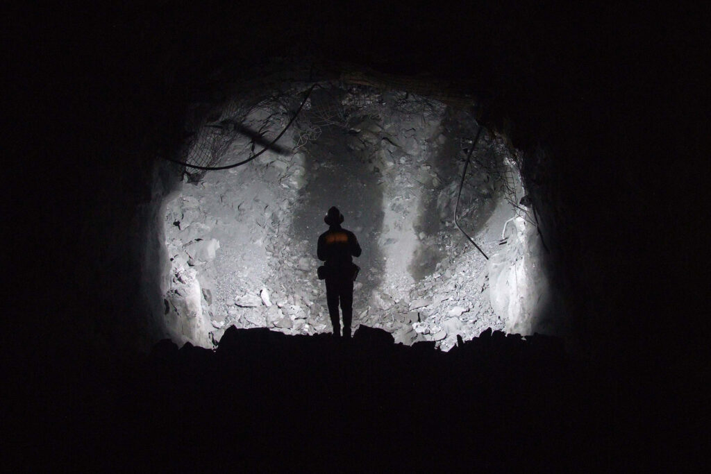 Man standing in a Bost mining location.
